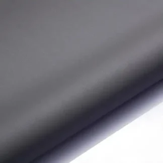 A close-up view of smooth, matte gray fabric with a soft gradient from dark to light, creating a sleek and minimalistic appearance.